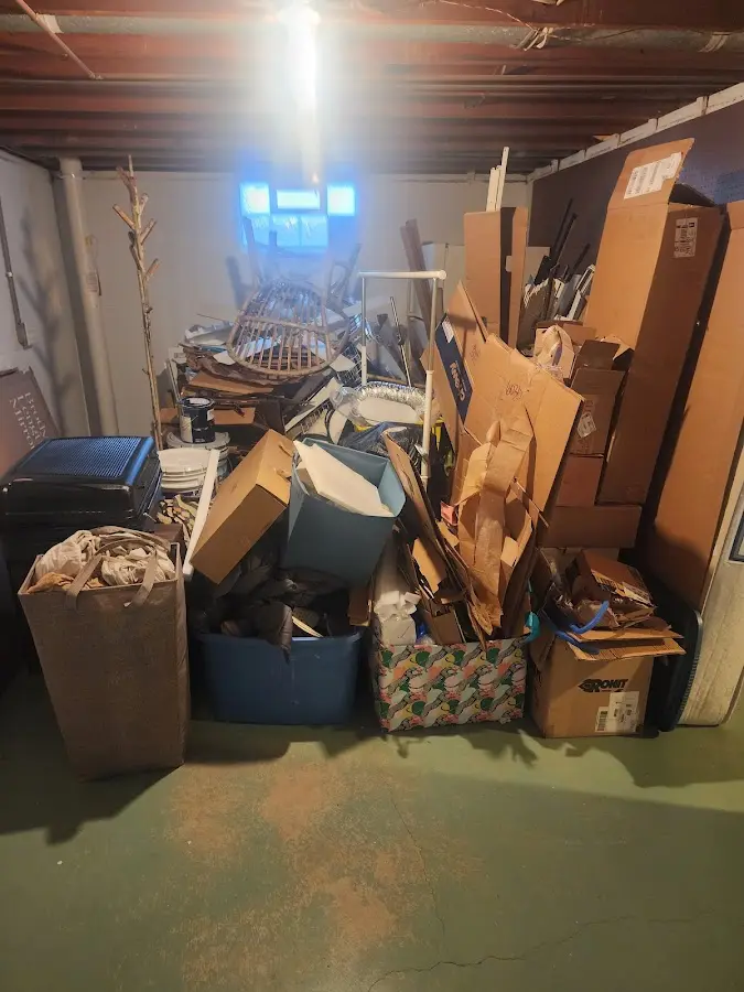 Roll-off dumpster container at job site for Concrete Dumpster Rental in Bedford